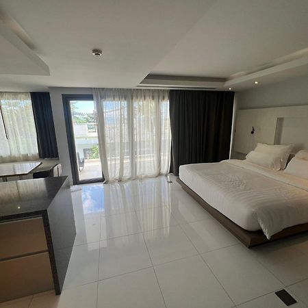 The Nchantra Beachfront Resort Phuket Exterior photo
