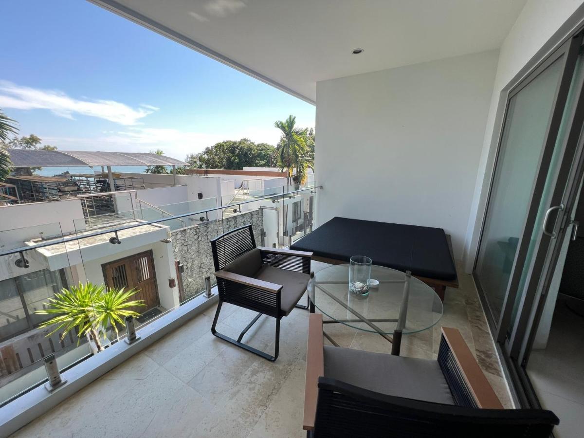 The Nchantra Beachfront Resort Phuket Exterior photo
