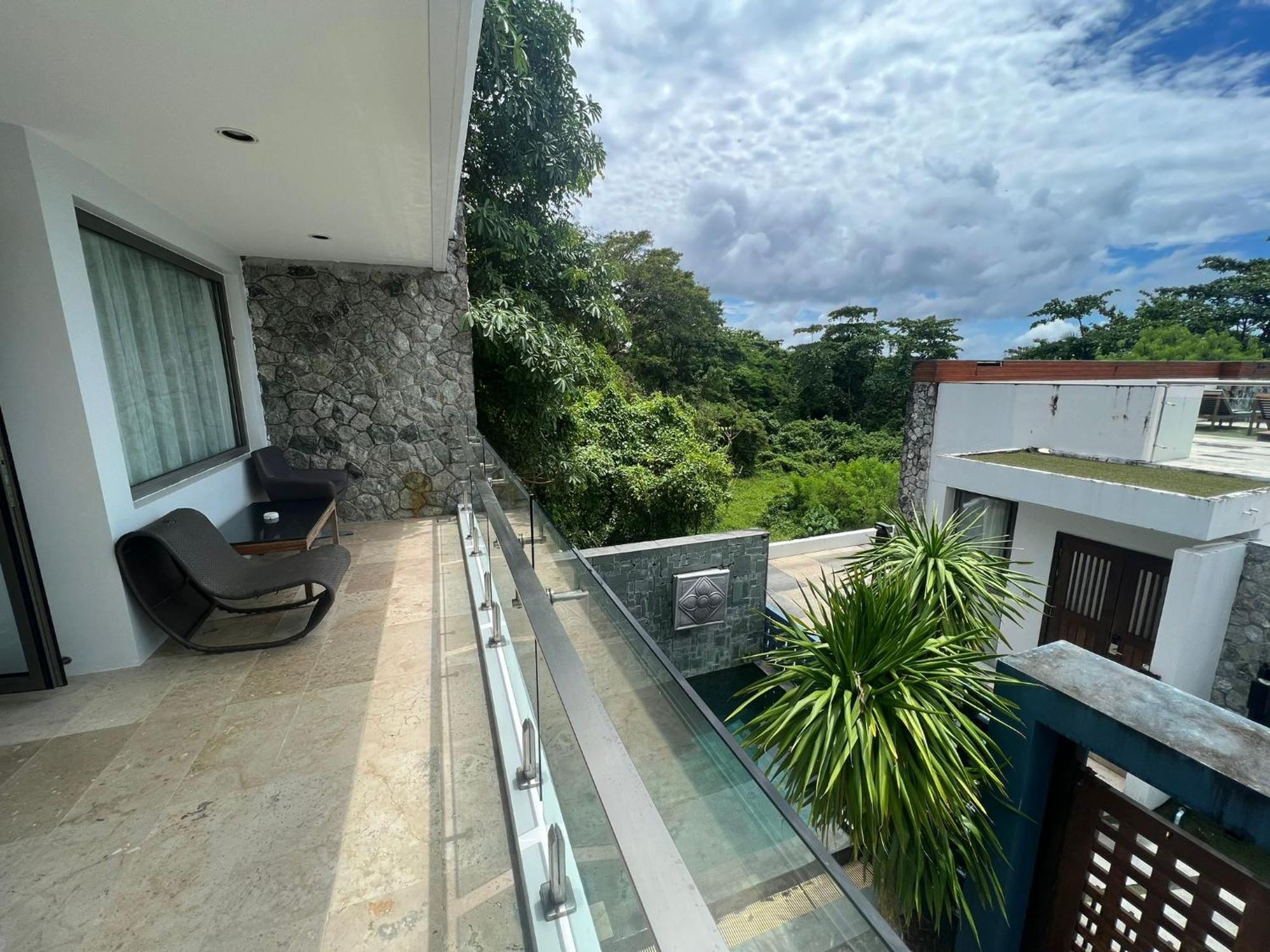 The Nchantra Beachfront Resort Phuket Exterior photo