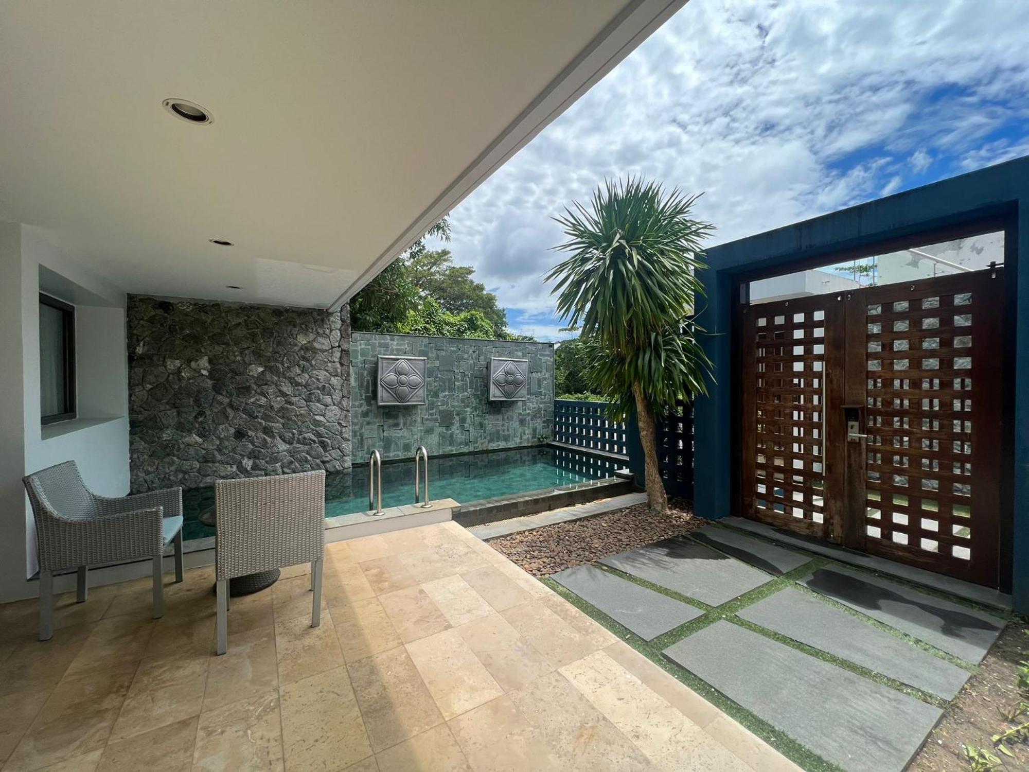 The Nchantra Beachfront Resort Phuket Exterior photo