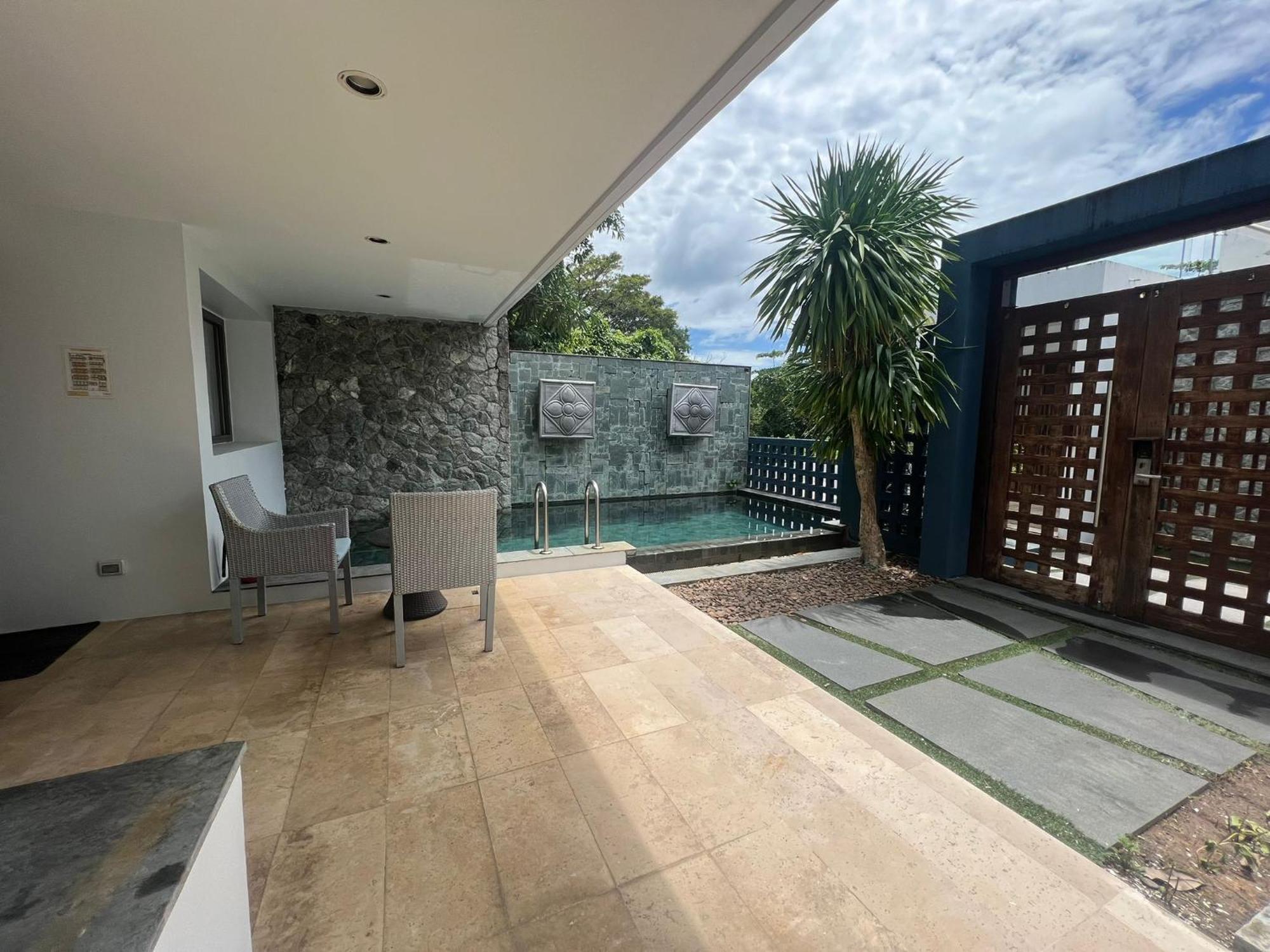 The Nchantra Beachfront Resort Phuket Exterior photo