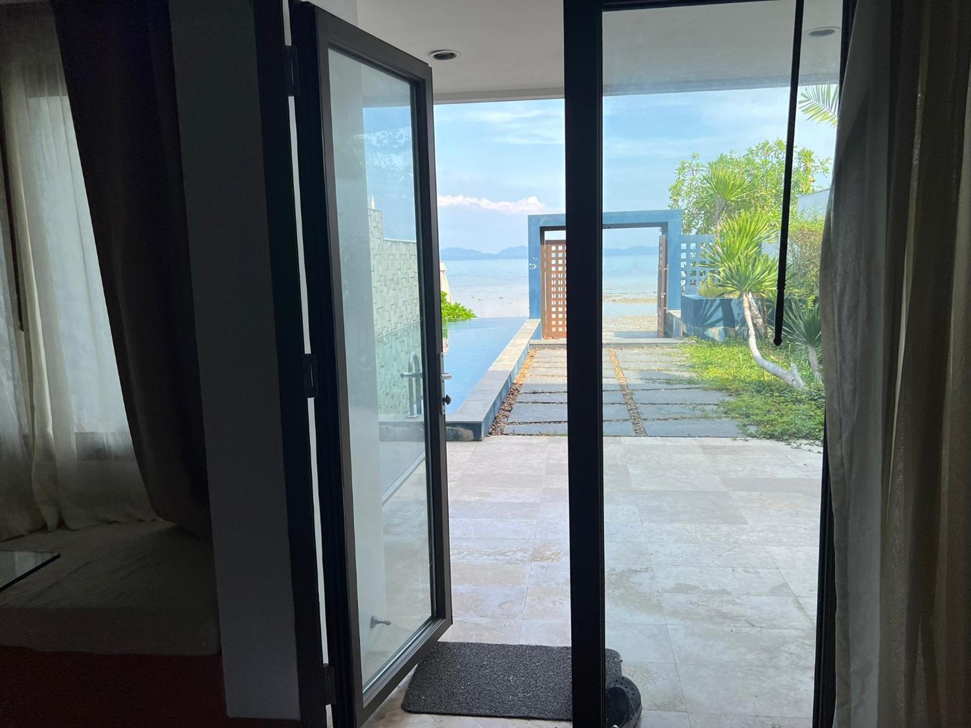 The Nchantra Beachfront Resort Phuket Exterior photo