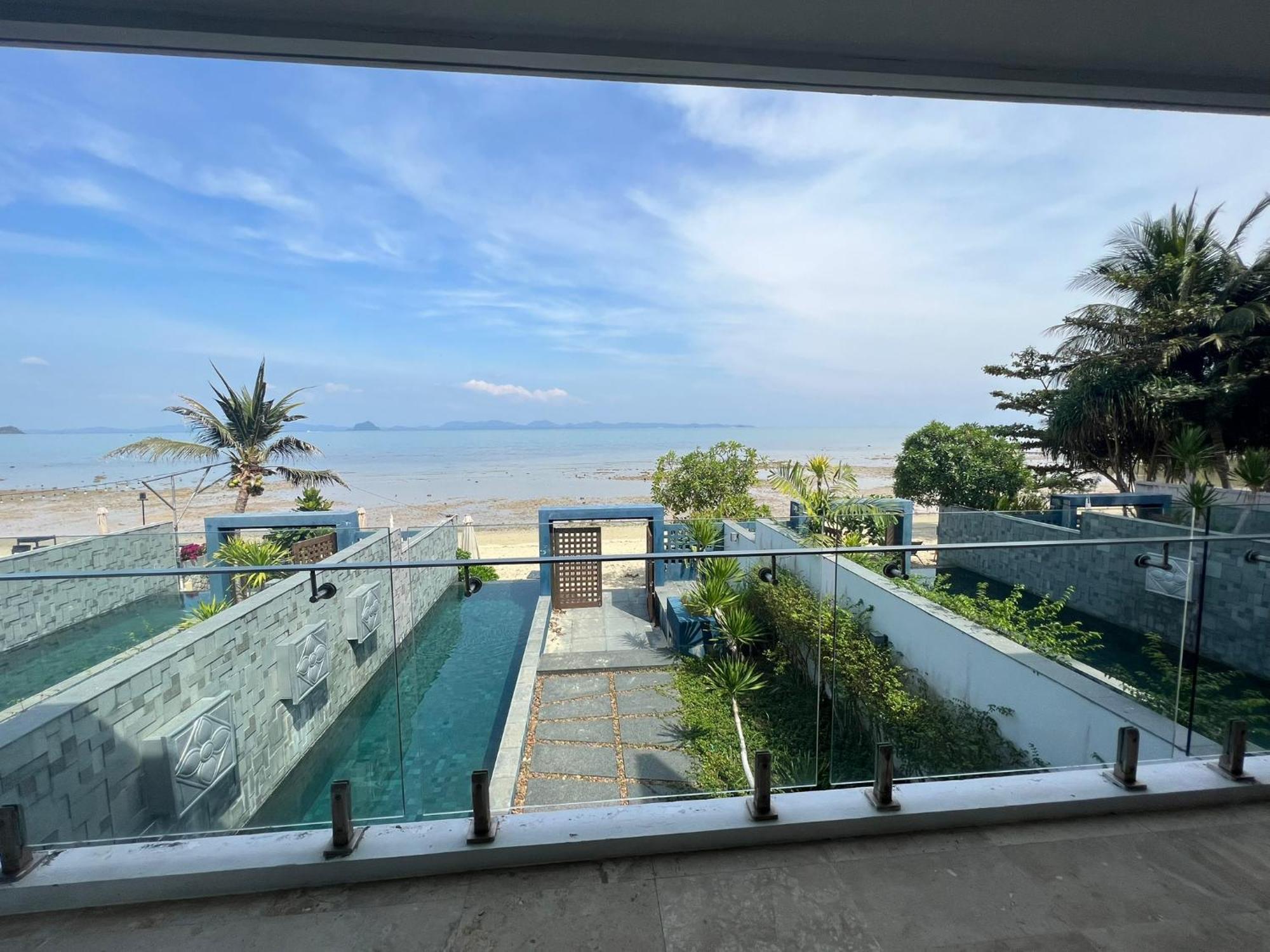 The Nchantra Beachfront Resort Phuket Exterior photo