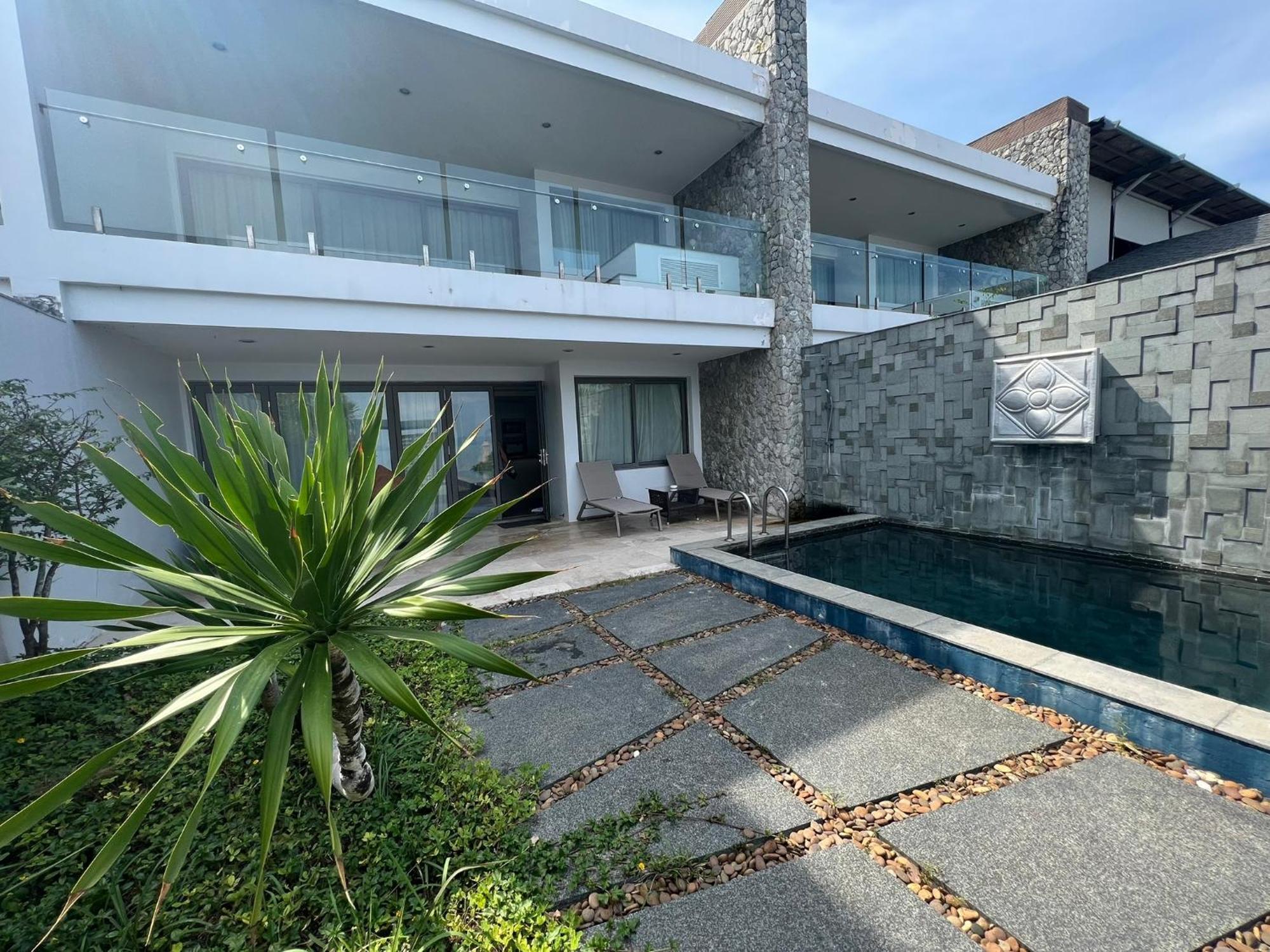 The Nchantra Beachfront Resort Phuket Exterior photo