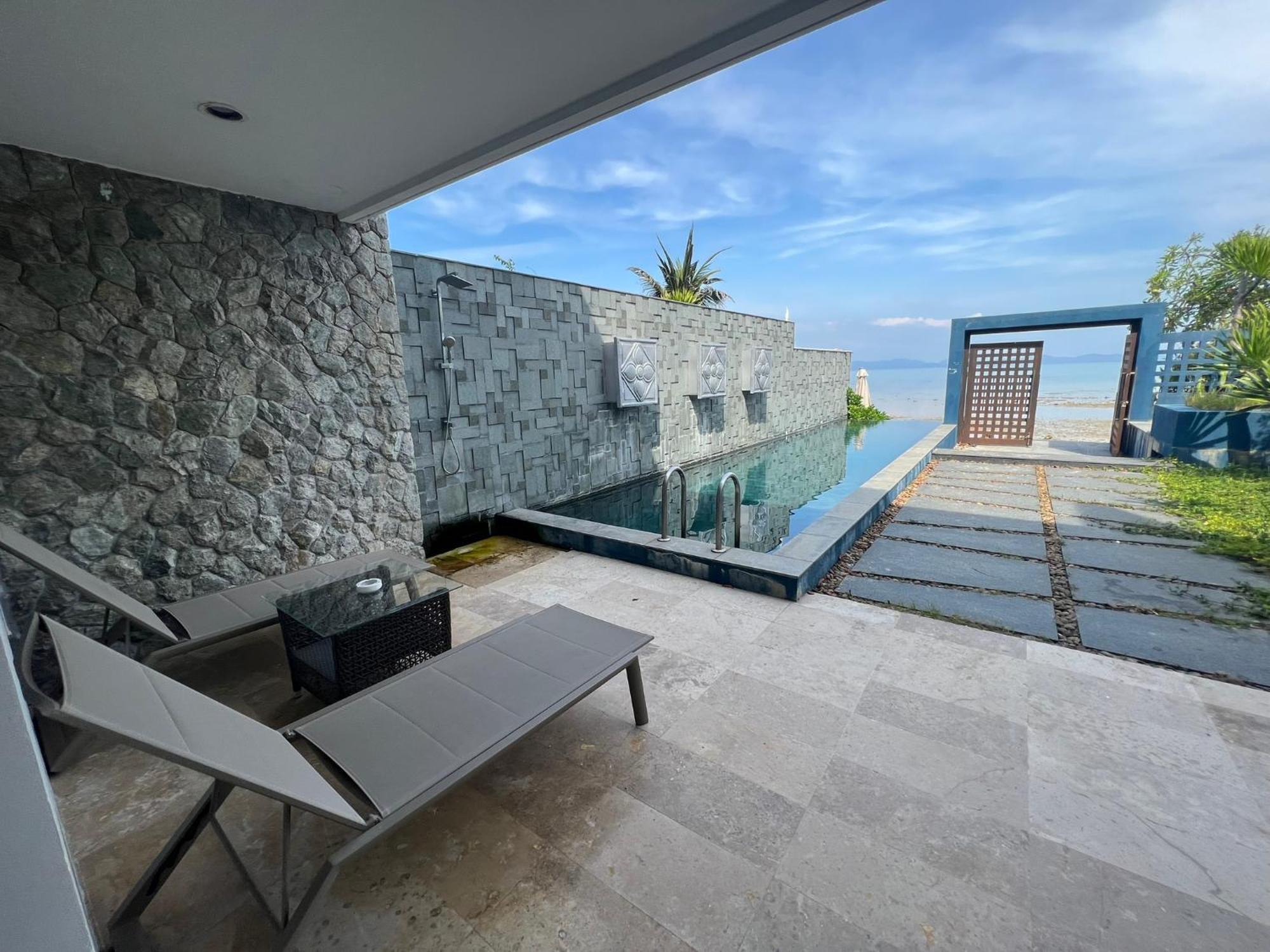The Nchantra Beachfront Resort Phuket Exterior photo