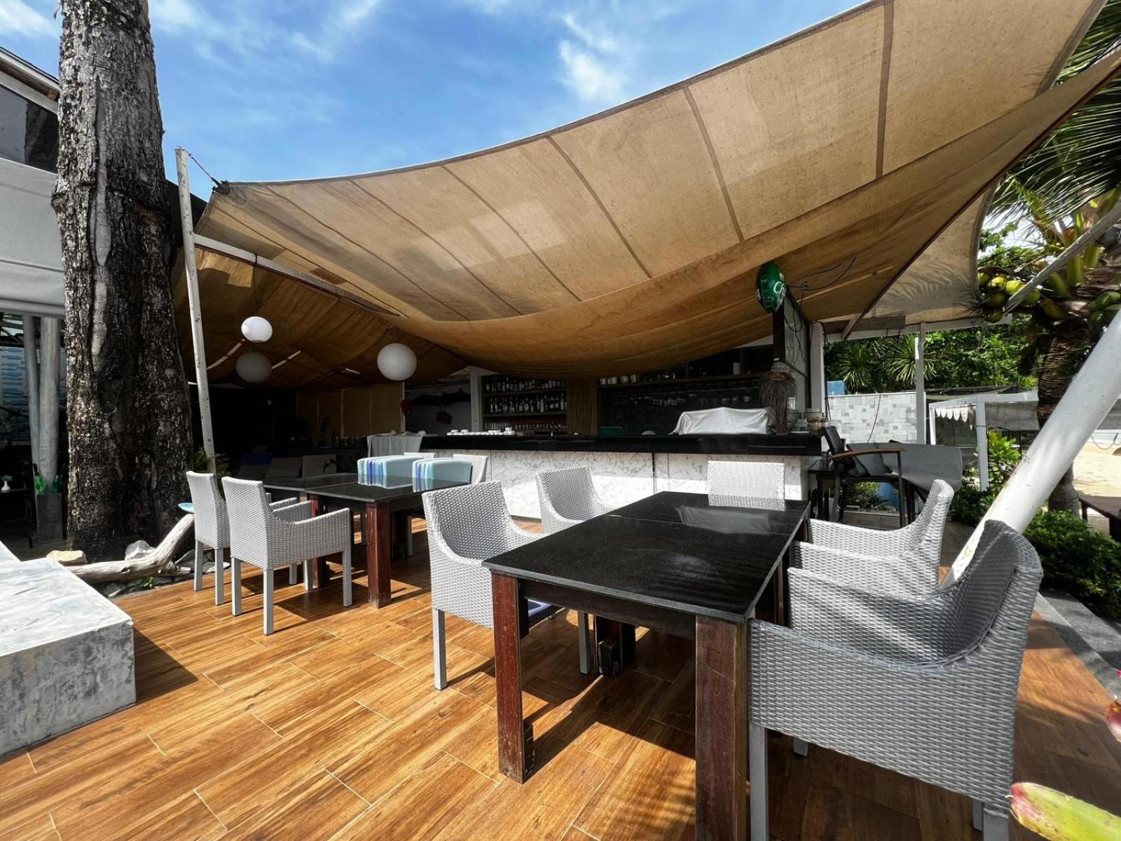 The Nchantra Beachfront Resort Phuket Exterior photo