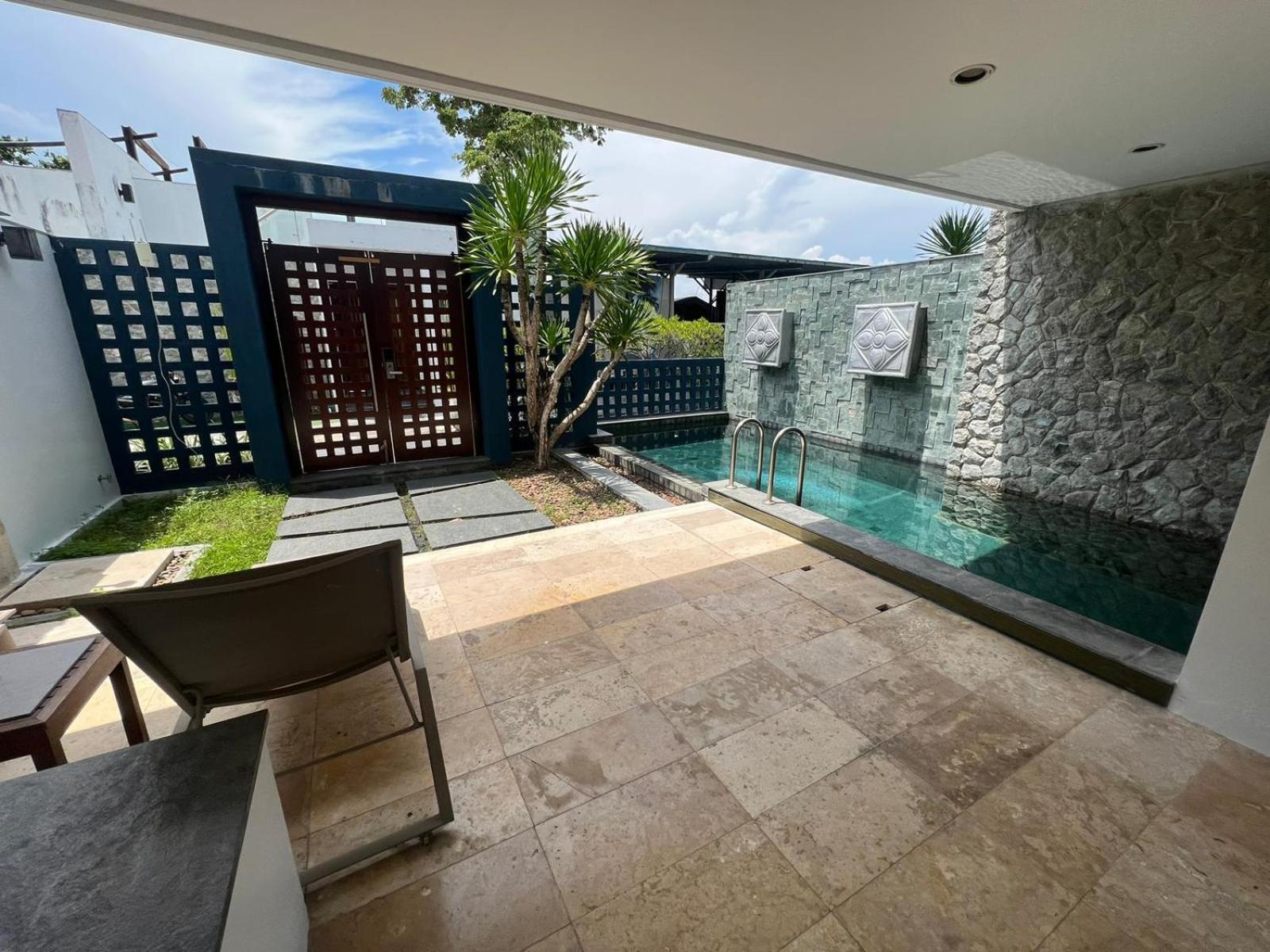 The Nchantra Beachfront Resort Phuket Exterior photo